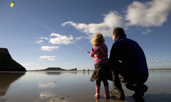 Flying a kite in Rhossili Bay, Gower, Swansea, Wales. ©National Trust Images/John Millar